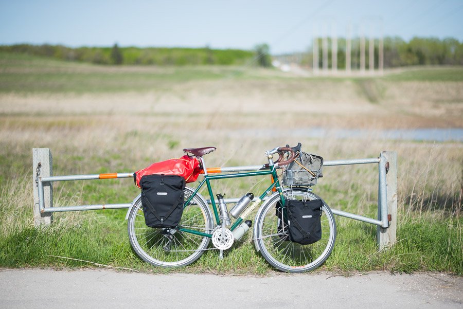 Step 2: Find ways to carry water and gear on said bike. I opted for dry-bag like panniers and what I could find lying around the apartment.