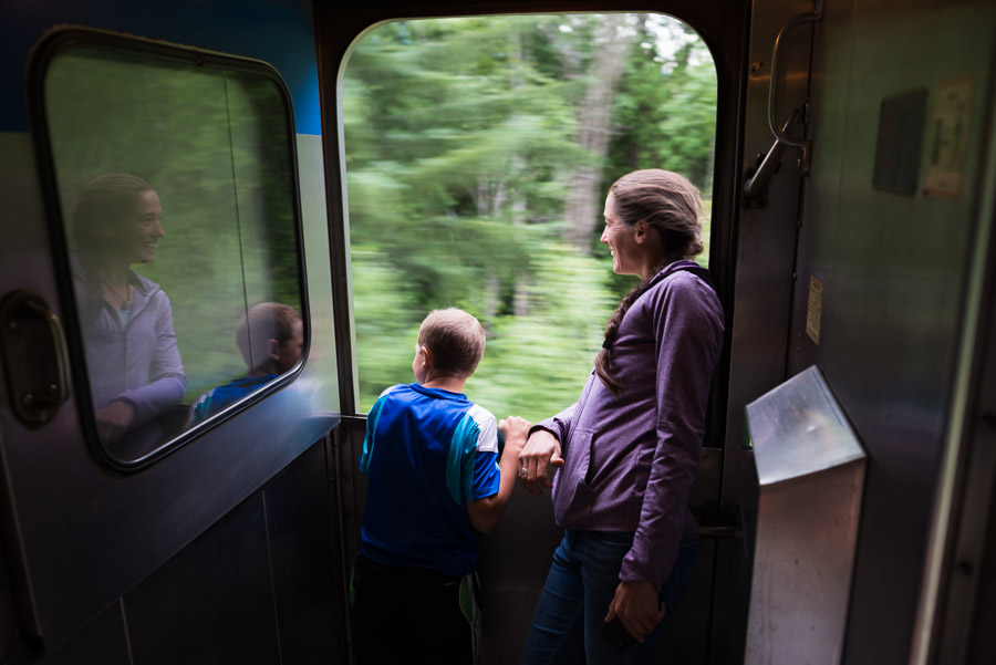A happy mother and son lean out train window enjoying the ride. Our train was only four cars long: an engine car, luggage car, passenger car, and dining car. For the bulk of our two day journey from Jasper to Prince Rupert, there were only half a dozen of us as passengers. With Diane’s encouragement, it was nice to relax and enjoy the ride in ways that you certainly couldn’t on the main line.
