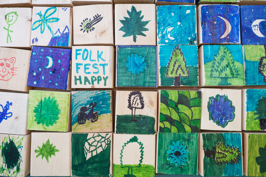 Folk Fest iconography painted by kids form an ever-growing collage.