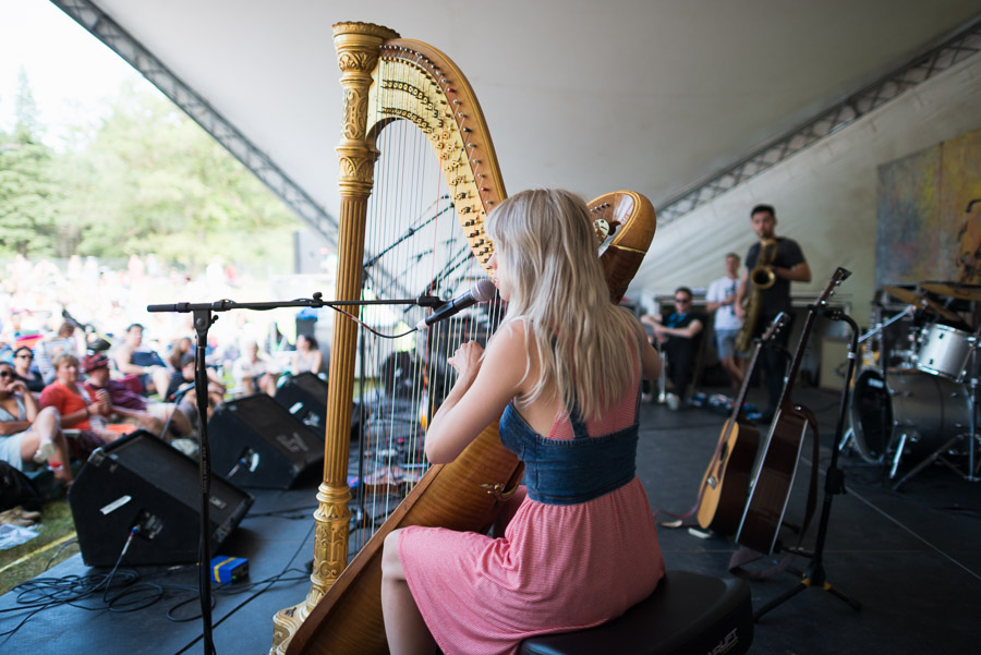 The crowd goes silent to listen to Mikaela Davis&rsquo; ethereal harp song.