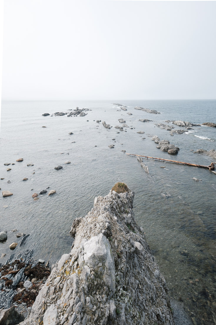 A rocky point fades into the distance.