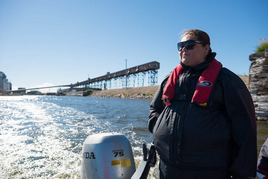 Exploring on land is a difficult ordeal on the soft tundra. In good weather, moving through the waterways is a great alternative for accessing the wilderness. Here, our guide Tiffany Spence captains a small inflatable Zodiac and takes us out of the port into the Churchill River.