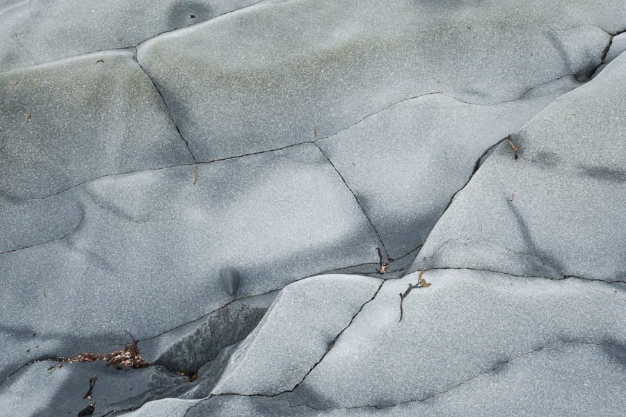 Exposed granite is incredibly smooth, scraped by the slow but forceful movement of ancient glaciers. Now that the great mass of ice has melted and is no longer weighing upon them, this bedrock is in fact rising in a process know as isostatic rebound (which amounts to it gaining a little more than one meter of elevation every year). This rock is part of the far-reaching Canadian Shield, and in this specific region it is known as Churchill Quartzite.