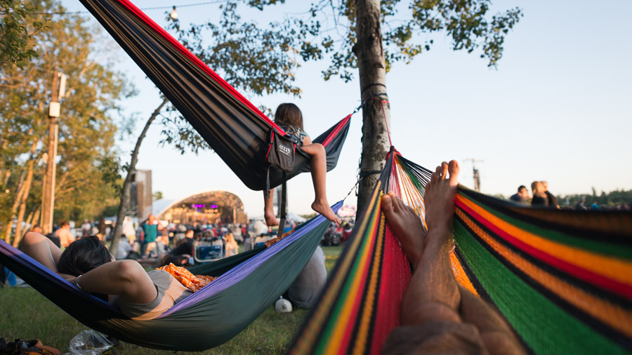 Hanging out and enjoying an evening of performances at the Winnipeg Folk Festival.Context: I was a photographer for the Winnipeg Folk Festival for seven years (2013-2020), building a wide collection of images including crowd moments like these that have been licensed further to organizations like Travel Manitoba. &ndash;link forthcoming&ndash;